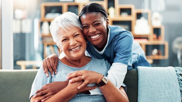 assisted-living-caregiver-helping-elderly-woman-home-1
